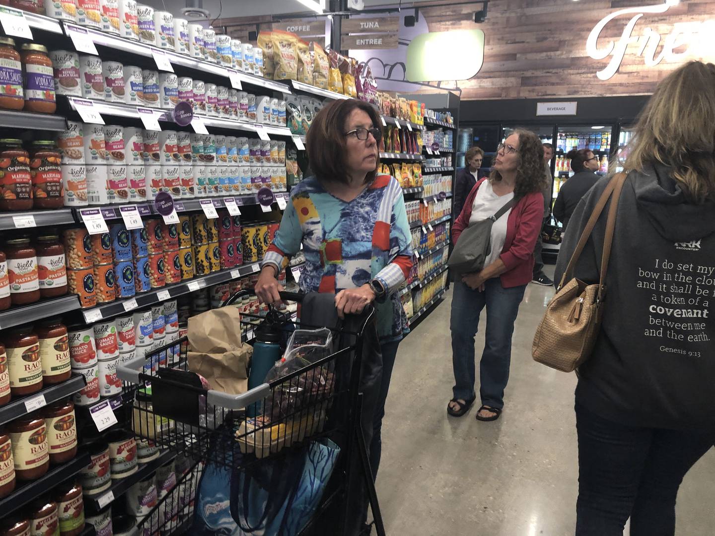 Shoppers peruse merchandise at the Food Shed Co-op in Woodstock grand opening May 15, 2024.