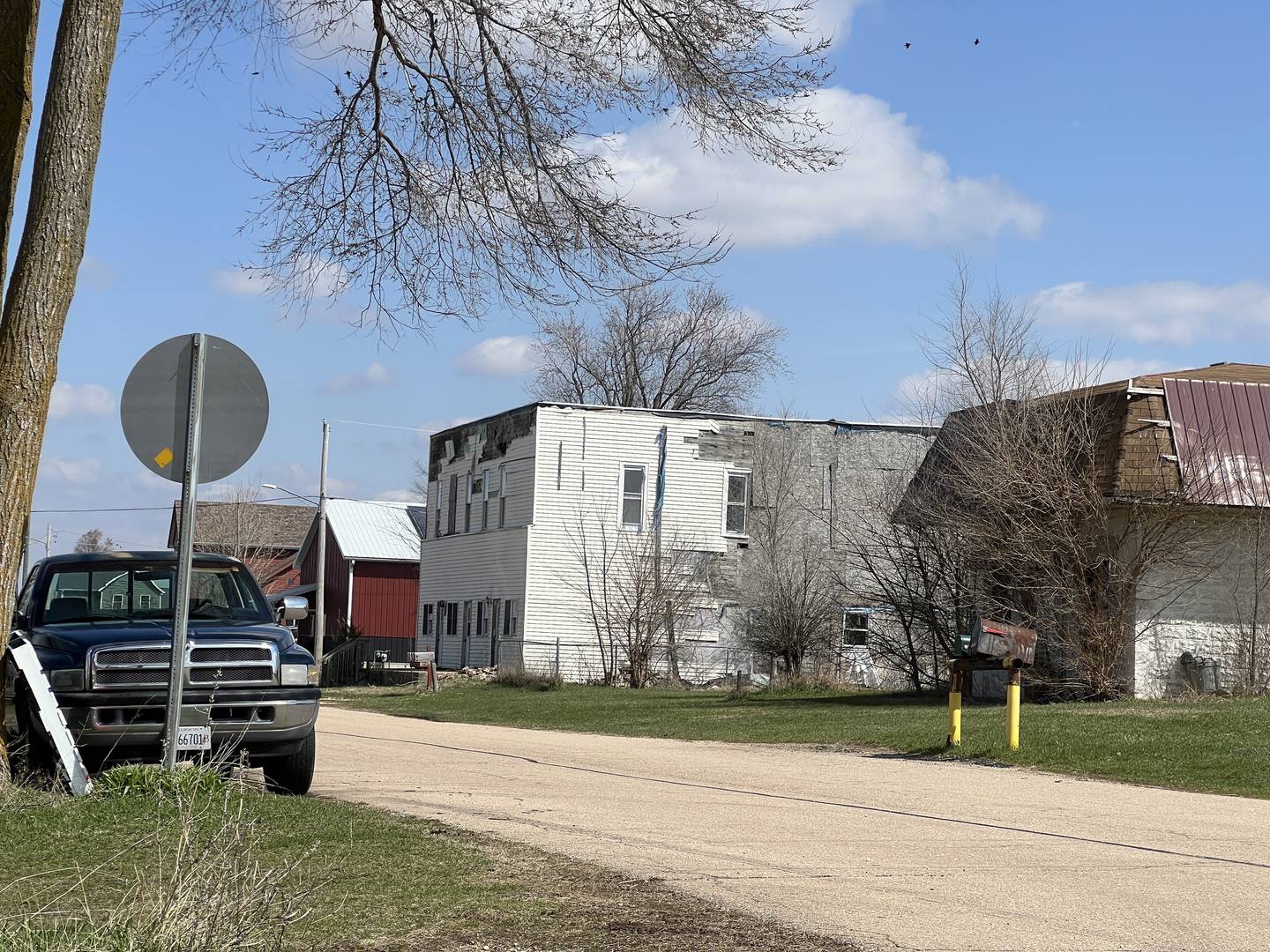 The siding of a multi-unit residence in Fairdale remains in disarray on April 11, 2025, 10 years and two days after an EF-4 tornado destroyed more than a third of the town's buildings.