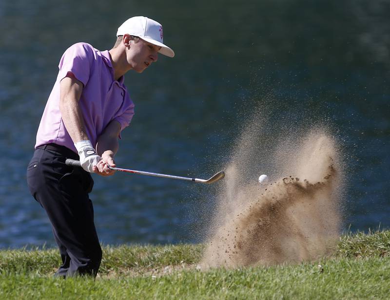 Hampshire’s Nolan Adamczyk hits out of the sand trap in the ninth green during the IHSA Class 3A Dundee-Crown Regional golf tournament on Wednesday, Oct. 2, 2024 at Randall Oaks Golf Club in West Dundee.