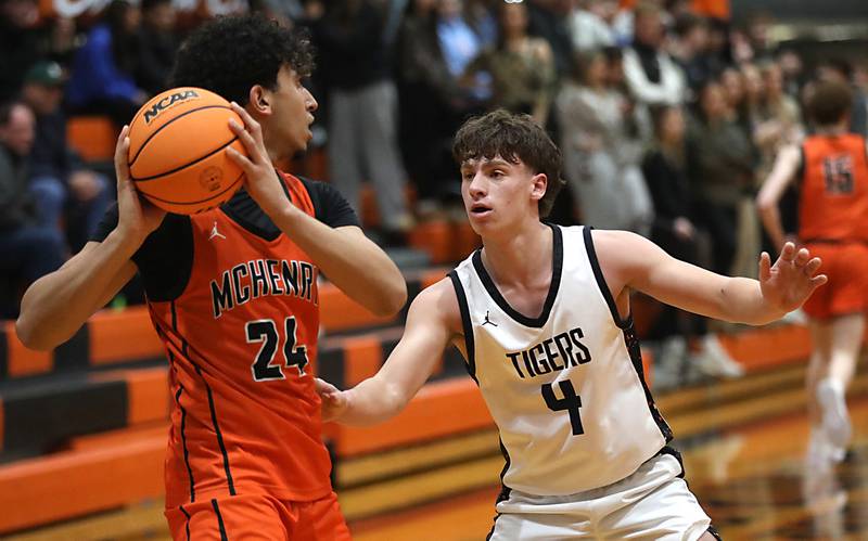 Crystal Lake Central's Bud Shanahan guards McHenry's Adam Anwar during a Fox Valley Conference boys basketball game on Tuesday, February. 10, 2026, at Crystal Lake Central High School.