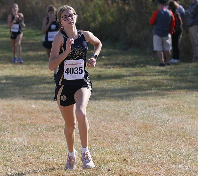 Marquette's Olivia Tamblyn runs in the Class 1A Regional Cross Country gils race on Saturday, Oct. 22, 2022 at the Seneca FFA Farm in Marseilles.