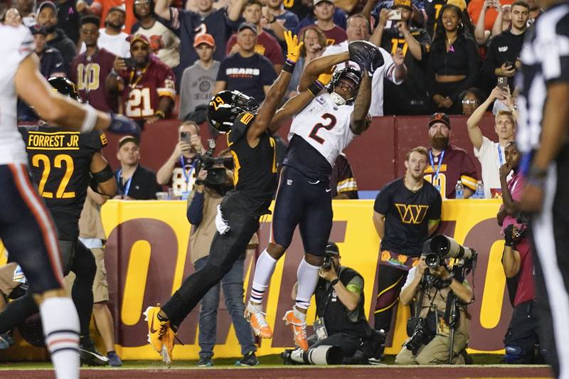 Chicago Bears wide receiver DJ Moore makes a touchdown catch against Washington Commanders cornerback Kendall Fuller during the first half of a 2023 game in Landover, Md.