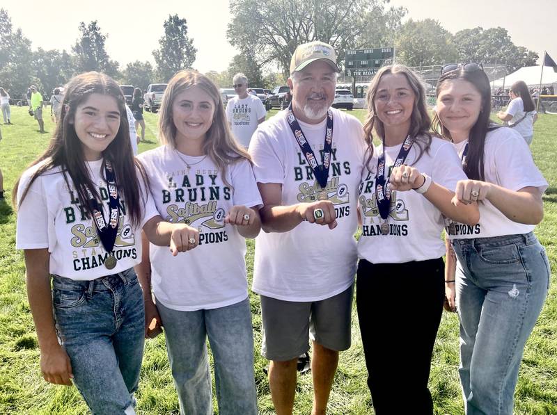 St. Bede players Lily Bosnich (from left), Addie Bontz, Ella Hermes and Bella Pinter along with coach Rick Pyszka show their state championship ring Saturday.