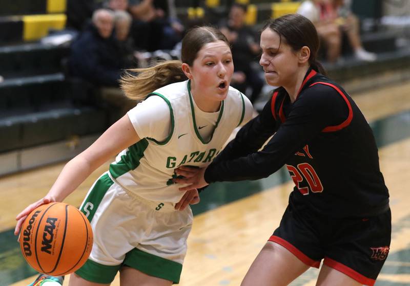 Crystal Lake South's Ellie Starnes tries to drive the baseline against Huntley's Alyssa Borzych during a Fox Valley Conference girls basketball game on Friday, Jan. 30, 2026, at Crystal Lake South High School.