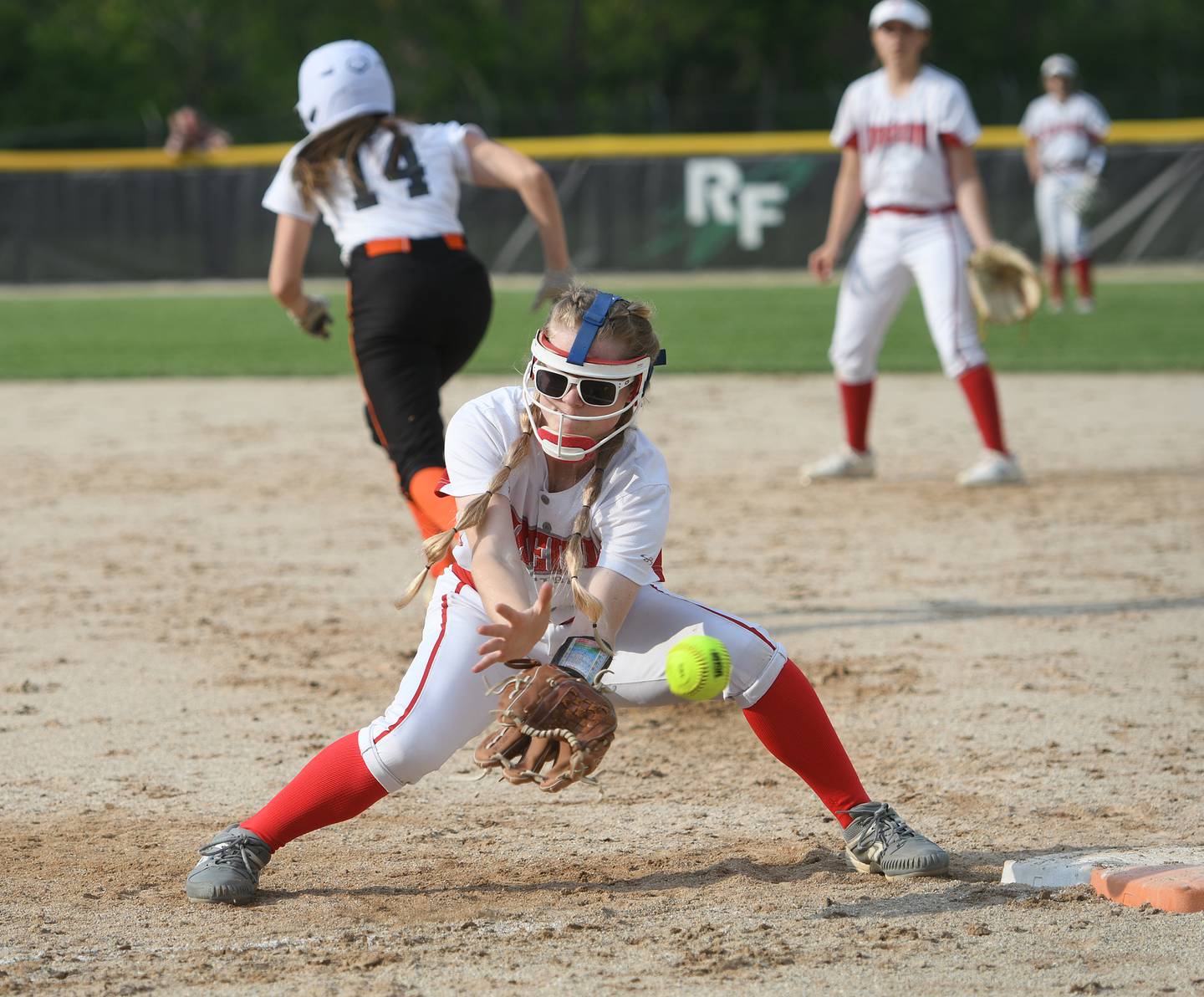 Oregon's Lena Trampel tries to field a low throw to first against Byron at the 1A Rock Falls Regional on Wednesday, May 18.