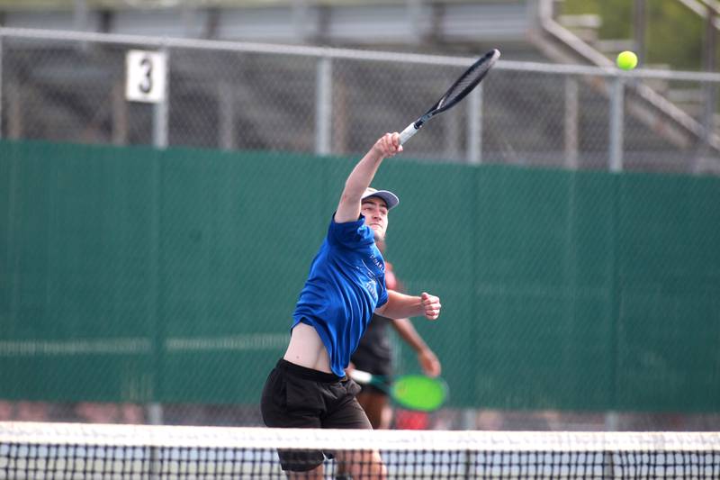 St. Charles North’s Cole Weddle returns the ball during the first round of the 2A boys state tennis meet with doubles partner Ben Goddard (not pictured) on Thursday, May 29. 2025 at Hersey High School.