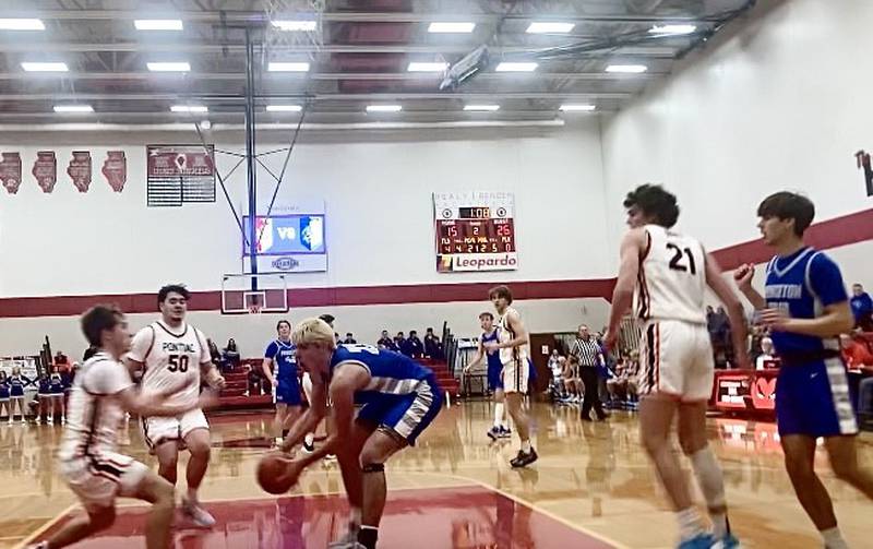 Princeton's Noah LaPorte makes a play in the paint Saturday against Pontiac. He scored 23 points to lead the Tigers to a 52-43 win over the Indians.