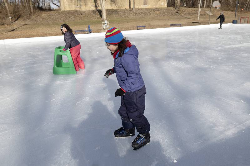 Ellie Ruiz (left), 8, and Harper Ruiz, 6, check out the ice Saturday, Jan. 11, 2025, at the Dixon Park District ice rink at Page Park. The rink opened late Friday.