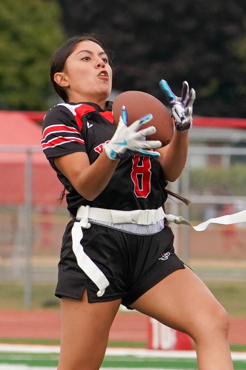 Yorkville's Teaghan Green (8) catches a pass during a flag football game against Joliet Central at Yorkville High School on Monday, Sep 23, 2024.