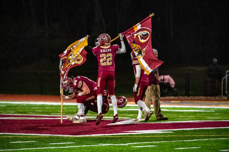 Morris's Will Knapp and Justin Hemmersbach fly the Redskins flag after winning the IHSA Quarterfinals game against Mahomet-Seymour Saturday Nov. 12, 2022 at Morris  High School