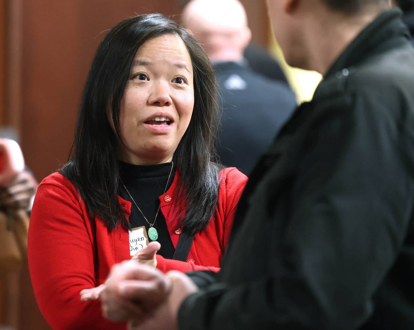 DeKalb mayoral candidate Linh Nguyen, who will have to win a primary to get her name on the ballot, talks to an attendee Wednesday, Feb. 19, 2025, at the DeKalb Area Rental Association and DeKalb Area Builders Association Candidate Night at Faranda's Banquet Center in DeKalb.