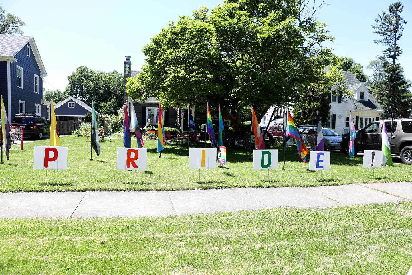 Scott and Mary Naylor’s Batavia home proudly displays over 16 flags representing LGBTQ+ orientations and identities.