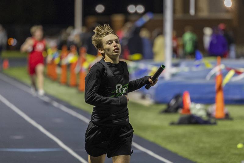 Rock Falls’ Carson Devers crosses the finish in the 4x200 Thursday, April 25, 2024 at the Sterling High School Night Relays.