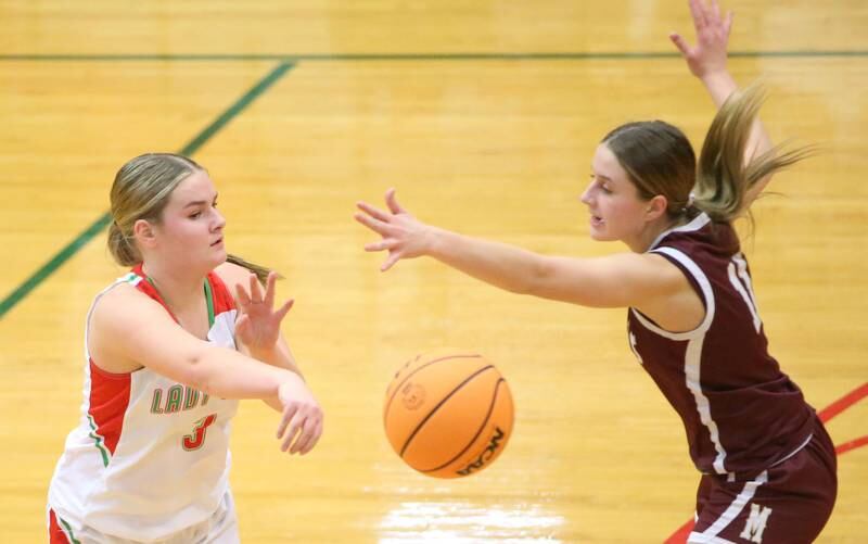 L-P's Emma Jereb passes the ball around Morris's Alyssa Jepson on Friday, Dec. 6, 2024 in Sellett Gymnasium at L-P High School.