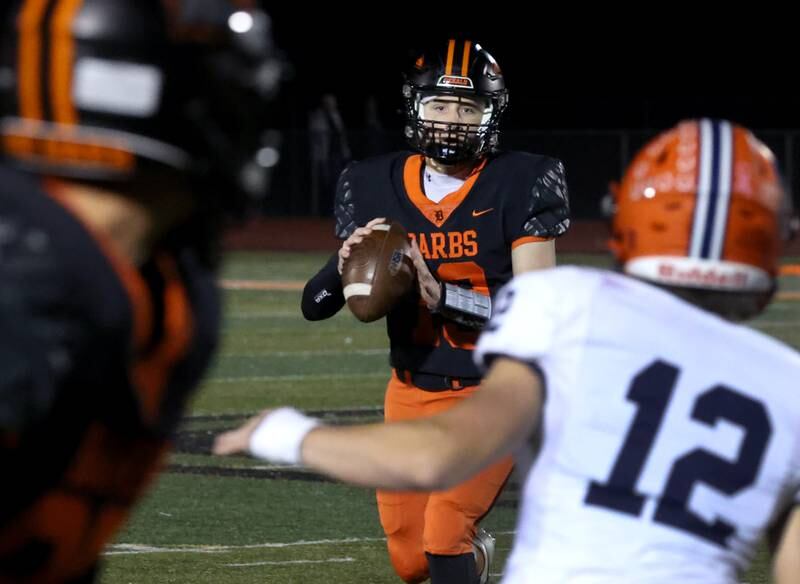 DeKalb's Michael Hodge throws a touchdown pass to DeKalb's Jack Rosenow who got behind the Stagg defense during their game Friday, Oct. 25, 2024, at DeKalb High School.
