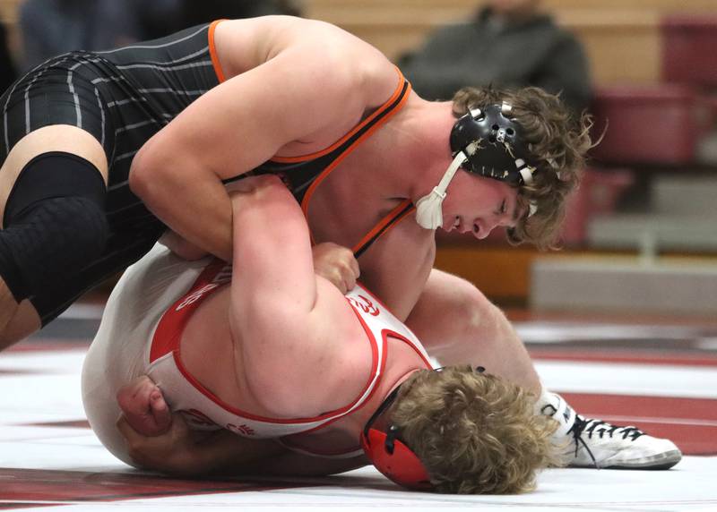 Huntley’s Dylan Cerny, bottom, battles Crystal Lake Central’s Cayden Parks at 190 pounds in varsity wrestling on Friday, Dec. 13, 2024 at Huntley High School in Huntley.
