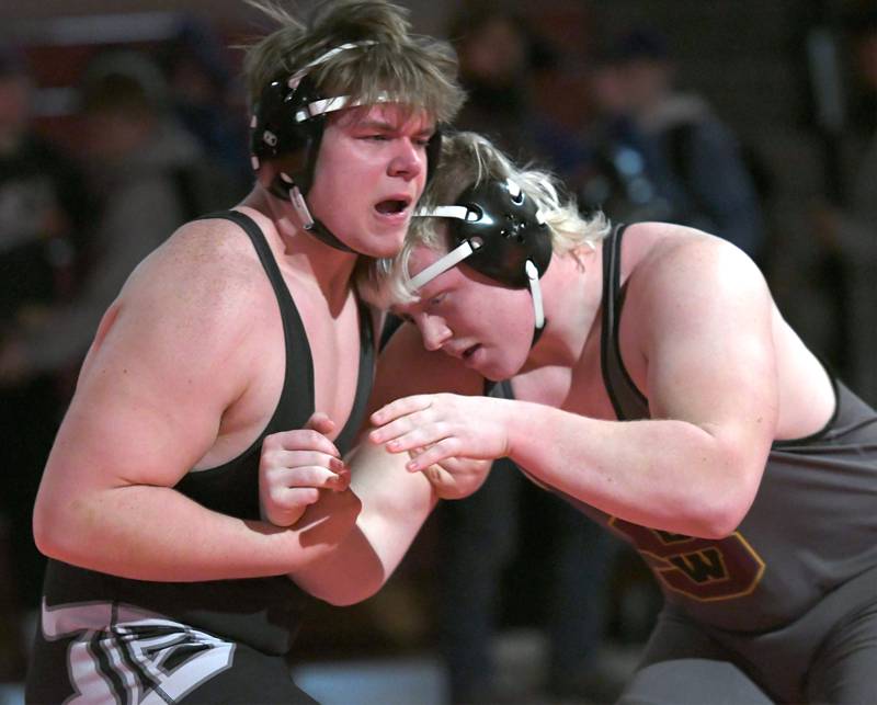 Dixon's Shaun DeVries (left) wrestles Lena-Winslow's Henry Engel for third place at 285 pounds at the 1A Oregon Wrestling Sectional on Saturday.