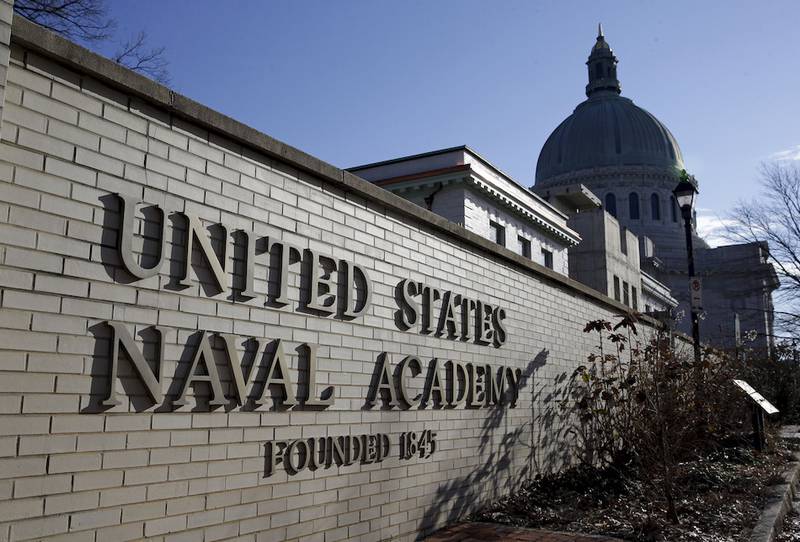 A sign stands outside of an entrance to the U.S. Naval Academy campus in Annapolis, Md., Thursday, Jan. 9, 2014. A culture of bad behavior and disrespect among athletes at U.S. military academies is one part of the continuing problem of sexual assaults at the schools, according to a new Defense Department report that comes in the wake of scandals that rocked teams at all three academies last year. (AP Photo/Patrick Semansky)