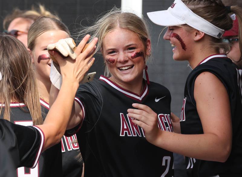 Antioch's Jacey Schuler is greeted in the dugout after hitting a homer during their Class 3A supersectional win Monday, June 3, 2024, over Sycamore at Kaneland High School in Maple Park.
