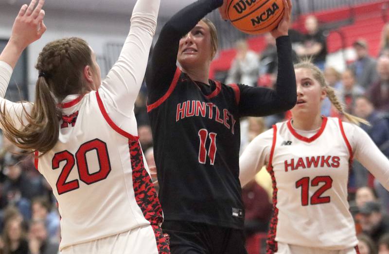 Huntley’s Anna Campanelli works under the hoop against Maine South in Komaromy Holiday Classic varsity girls basketball championship game action on Monday, Dec. 30, 2024, at Dundee-Crown High School in Carpentersville.