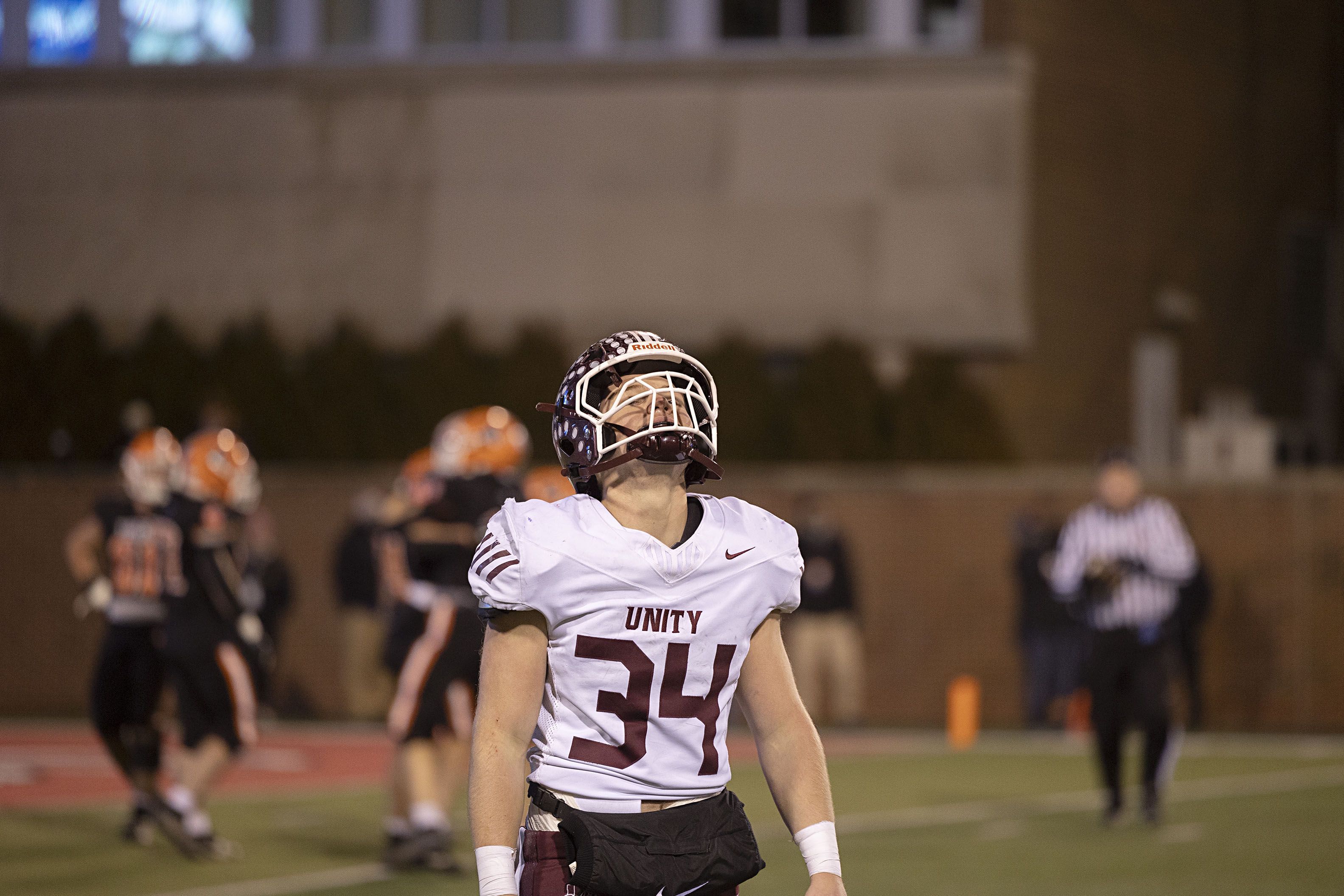 Tolono-Unity's Crewe Eckstein walks off the field as time expires Friday, Nov. 28, 2025, in the Class 3A football finals at Hancock Stadium at ISU.