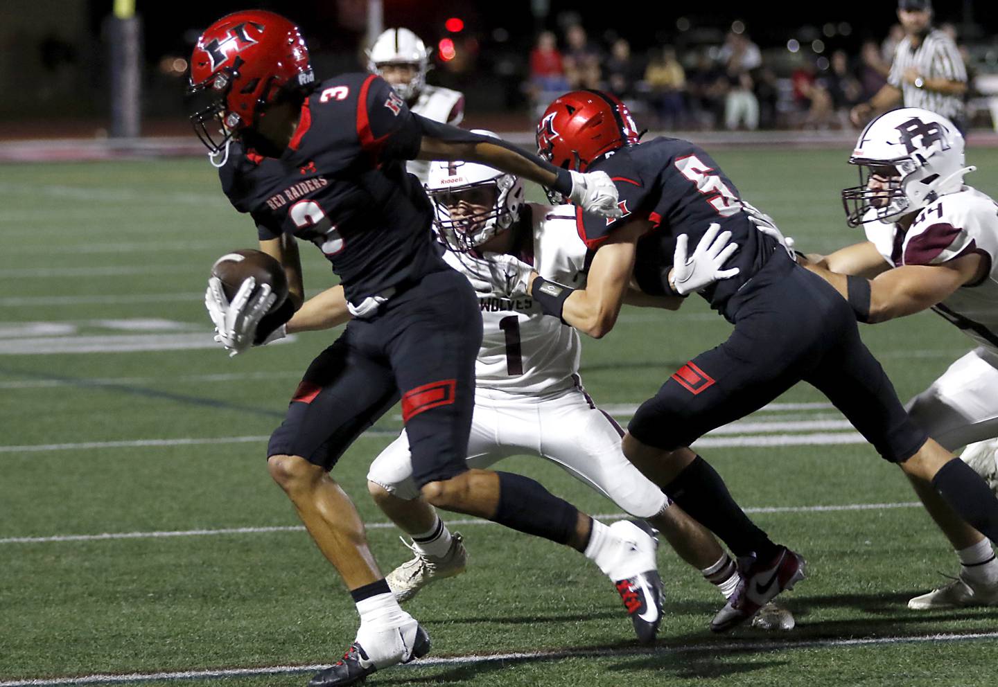 Huntley's Jordan Oruche tries to spin away from Prairie Ridge's Nick Petty during a Fox Valley Conference football game on Friday, Sept. 20, 2024, at Huntley High School.