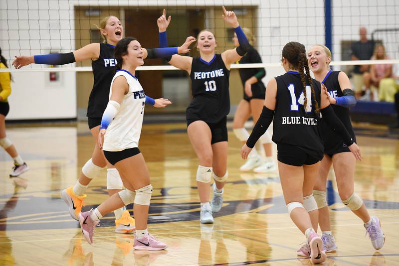 Members of the Peotone girls volleyball team celebrate a point during a home game against Coal City Thursday, Sept. 18, 2025.