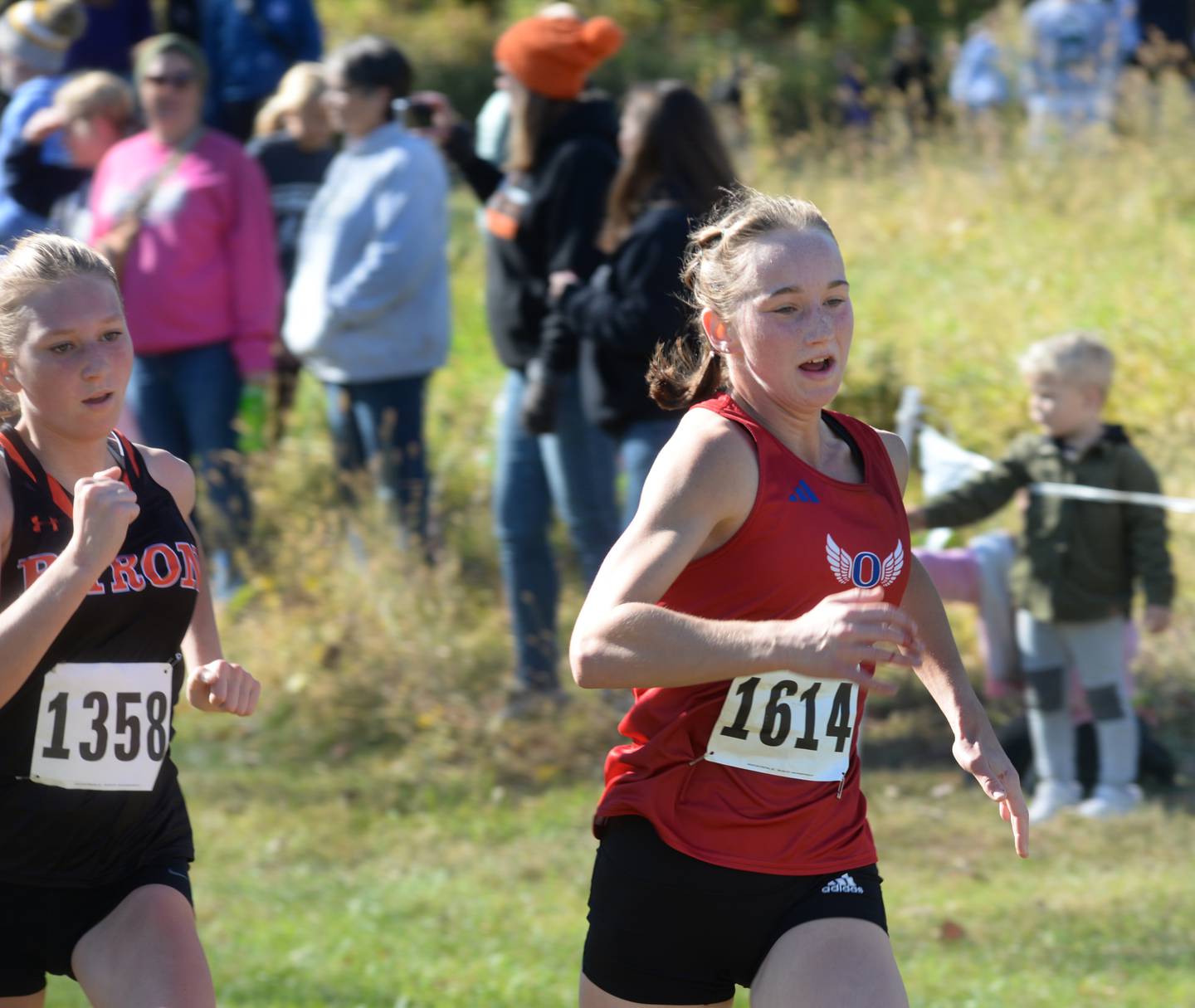Oregon's Ella Dannhorn (right) races Byron's Elinor McHale to the finish line at the 51st Annual Columbus Day Invitational at Shady Oaks Golf Club in Sublette on Monday, Oct. 14. 2024.