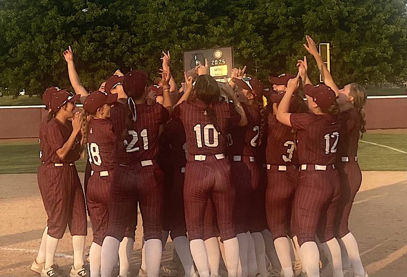 Lockport's softball team celebrates after beating Lincoln-Way Central 2-0 in 10 innings for the Class 4A Lockport Sectional title.