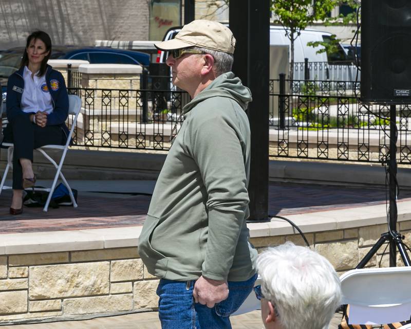 A Marine veteran stands during the presentation of the Marine colors during the Memorial Day Commemoration at Joliet City Square.  May 20, 2026 in Joliet.