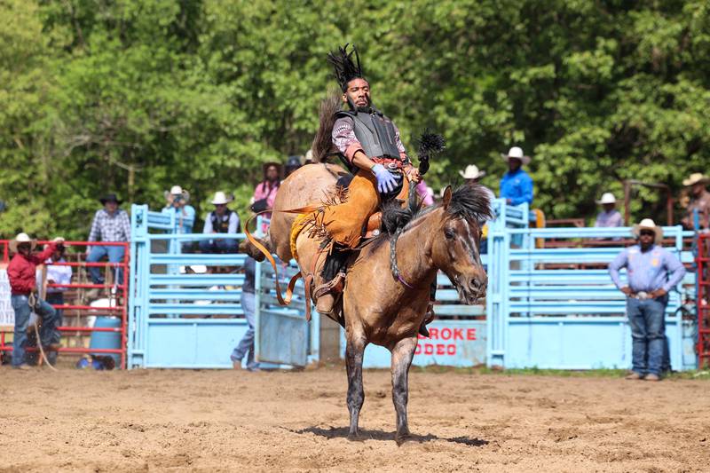Jose Pedraza, of Madison, Wisc., competes in bronc riding during the 50th Pembroke Rodeo on Sunday, May 24, 2026.