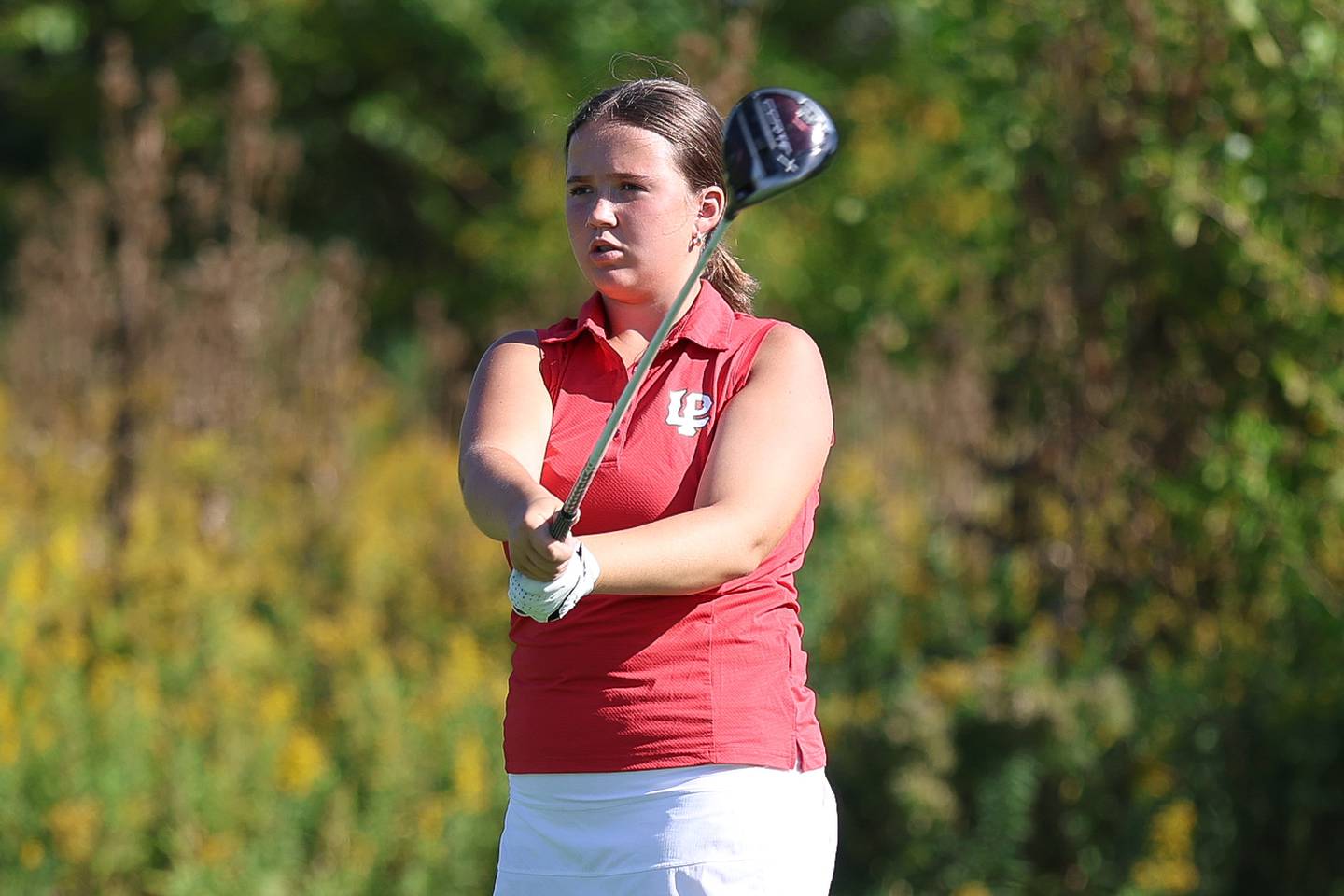 LaSalle-Peru's Mary Craven watches her drive off the 12th hole in the 2A Rich Township Regional girls golf tournament on Tuesday, Sept. 30, 2025 in University Park.