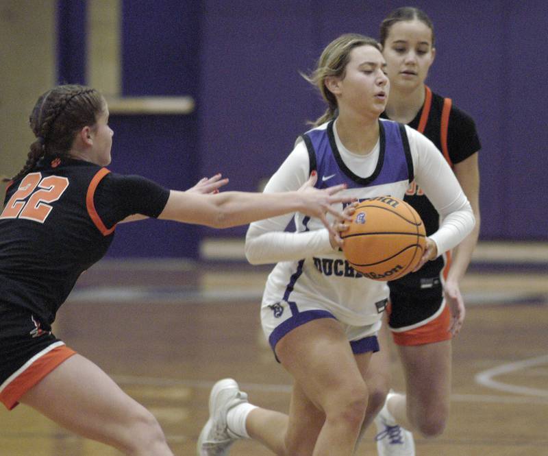 Dixon's Reese Dambman brings the ball up around two Byron defenders. The Dixon Duchesses hosted Byron in girls basketball Saturday, Jan. 25, 2025.