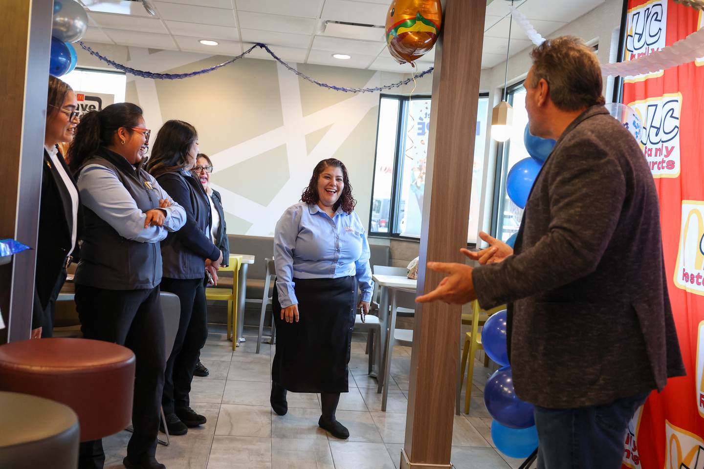 Kankakee resident Maribel Rodriguez, general manager of the North Fifth Avenue McDonald's, is surprised with a Ray Kroc Award by local franchisee owner John Carnagio, right, at the Kankakee location on Tuesday, Oct. 21, 2025. The recognition is presented to less than 1% of managers across the McDonald’s Corporation.