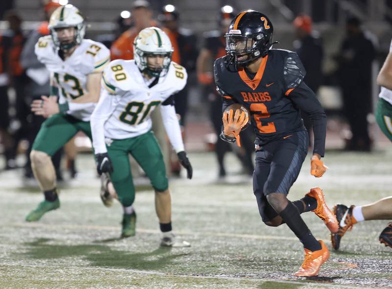 DeKalb's Jamari Brown gets by Waubonsie Valley's Dakota Brdar during their game Thursday, Oct. 20, 2022, at DeKalb High School.