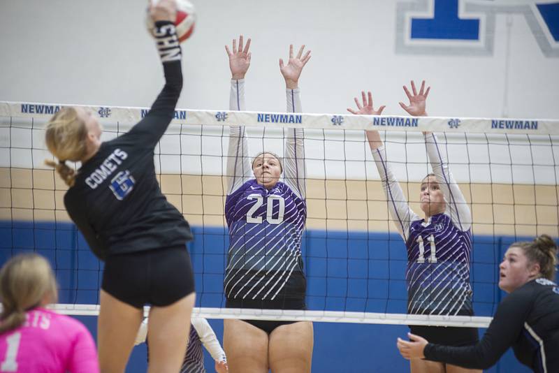 Dixon’s Olivia Cox (left) and Ella Govig go up to block a shot by Newman’s Jess Johns Monday, Aug. 29, 2022.