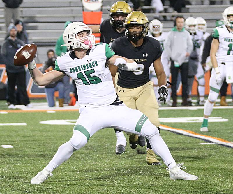 Providence Catholic's quarterback Anthony Picciolini (15) looks to throw a pass as Sacred Heart-Griffin's Maddixx Morris (6) defends in the Class 4A state title on Friday, Nov. 25, 2022 at Memorial Stadium in Champaign.