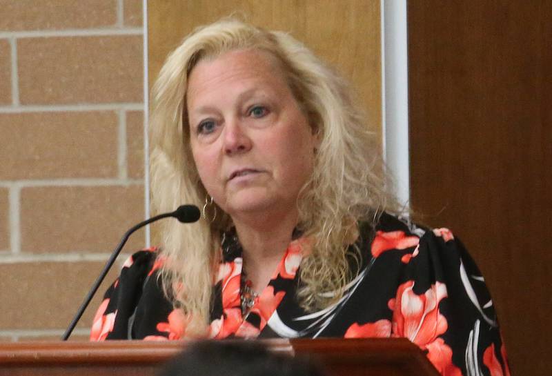 Dawn Trompeter, president of OSF St. Elizabeth Medical Center, speaks to the Illinois Health Facilities and Services Review Board during a public hearing regarding OSF St. Elizabeth Hospital's plans to reduce services on Tuesday, June 10, at Central Intermediate School in Ottawa.