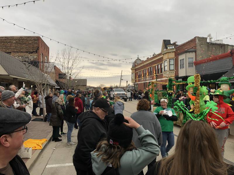 Participants in the St. Patrick's Day parade march down the street on Saturday, March 11 in downtown Utica.