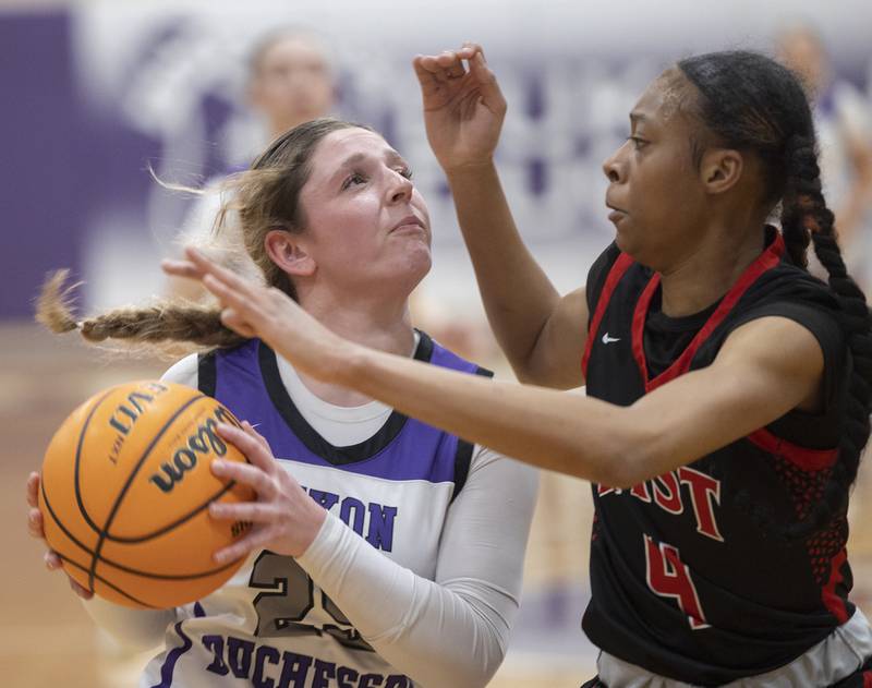 Dixon’s Presley Lappin looks to make a play against Rockford East’s J’Lynn Sims Monday, Feb. 16, 2026.