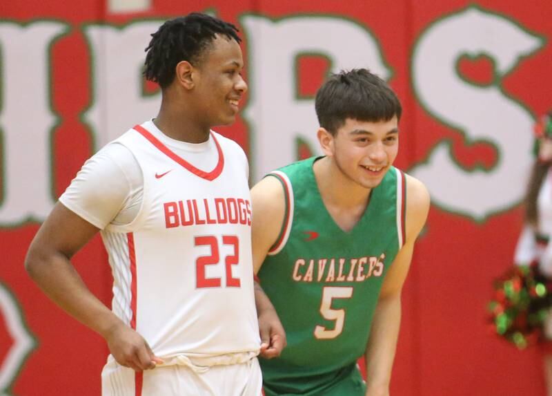 Streator's Tristin Finlay smiles with L-P's Erick Sotelo before the jump ball during the Class 3A Regional title game on Friday, Feb. 28, 2025 in Sellett Gymnasium at L-P High School.