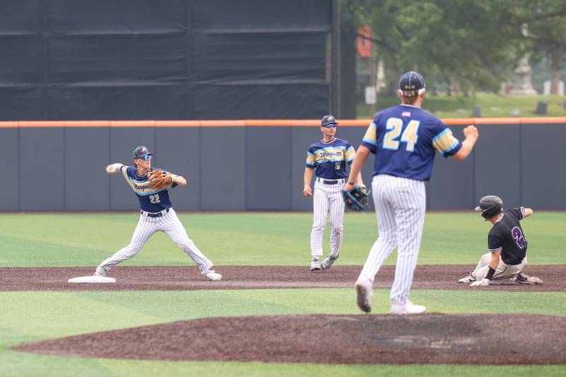 Ottawa Marquette’s Griffin Dobberstein throws to first for a double play during the Crusaders' 16-1 victory over Lexington in the IHSA Class 1A State semifinal on Friday, June 6, 2025.