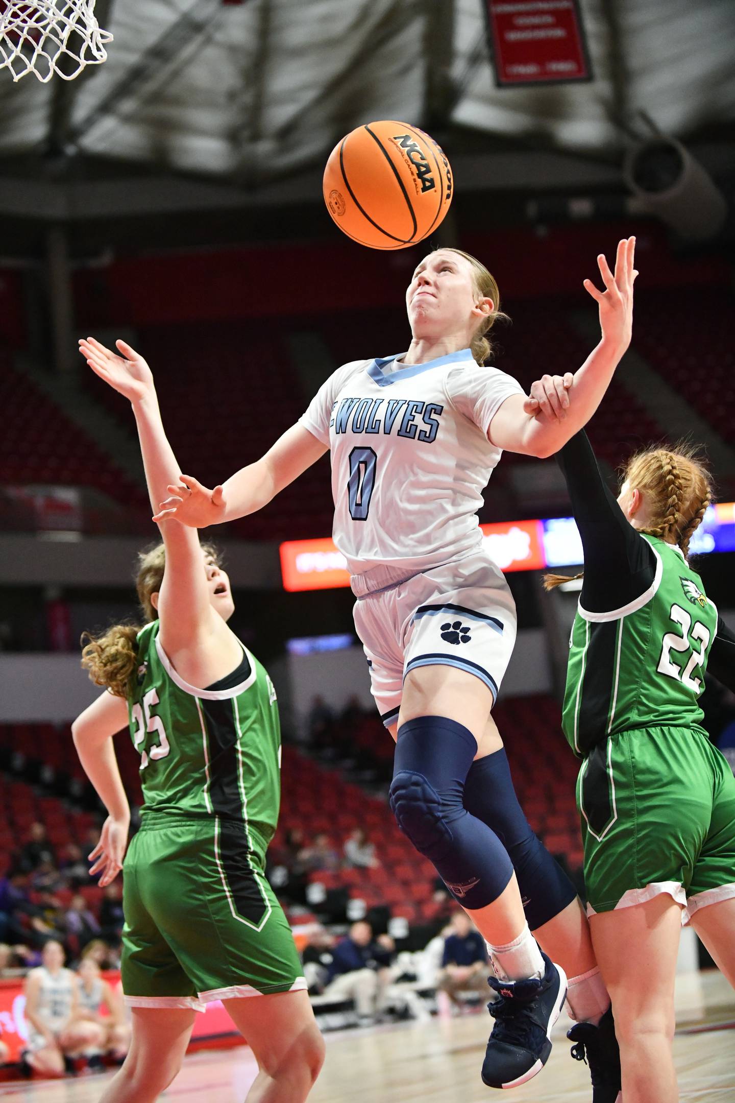 CIssna Park's Addison Lucht draws a foul on a layup during the Timberwolves' 55-39 loss to Carrollton in the IHSA Class 1A State semifinal on Thursday, March 6, 2025. Cissna Park advances to the third place game on Friday, March 7.