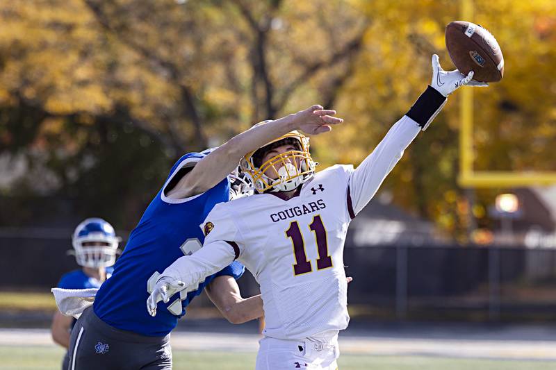 A pass is just out of reach of ROWVA’s Lewis Sams as defended by Newman’s Cody McBride Saturday, Oct. 28, 2023 in the Class 1A playoffs in Sterling.