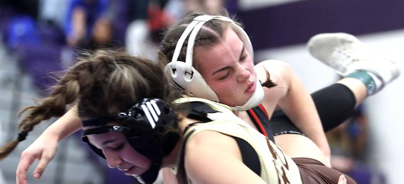 Huntley’s Aubrie Rohrbacher, right, throws Jacobs’ Aryanna Geiger at 130 pounds in varsity girls IHSA Regional Championship wrestling action on Saturday, February 7, 2026, at Hampshire High School in Hampshire.