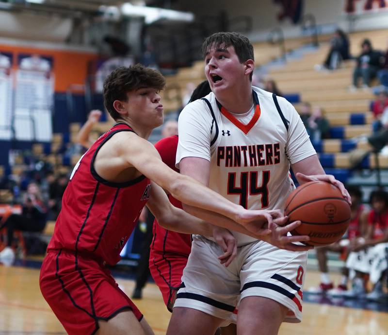 Oswego’s Hunter O’Neill (44) plays the ball in the post against West Aurora's Gabriel Gonzales (24) during a basketball game at Oswego High School on Friday, Dec 1, 2023.