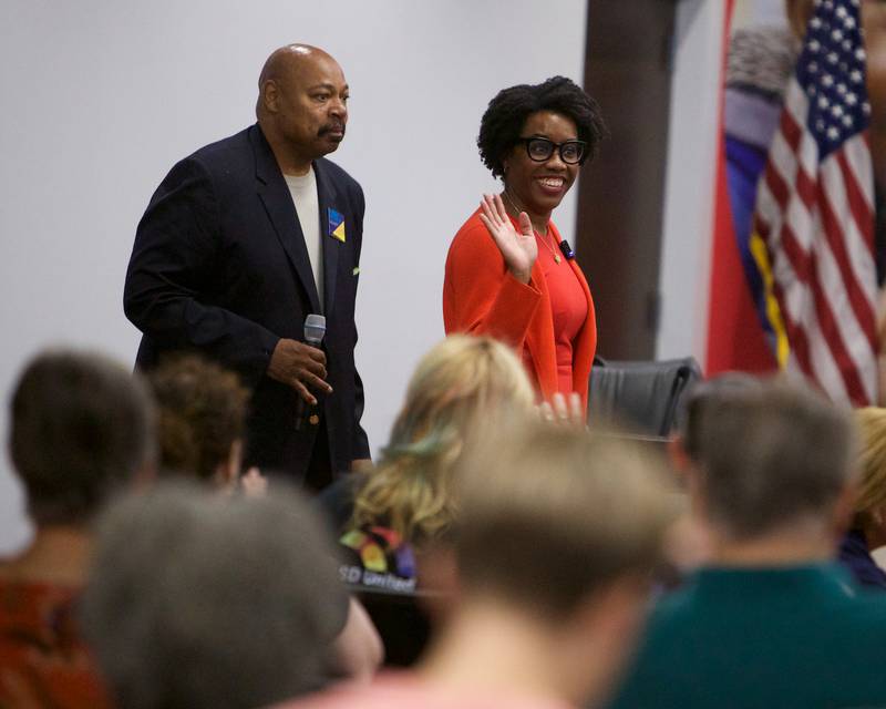 U.S. Rep. Lauren Underwood, D-Naperville, enters a crowded room to host a town hall at East Aurora School District 131 on Saturday, Aug.9, 2025, in Aurora.