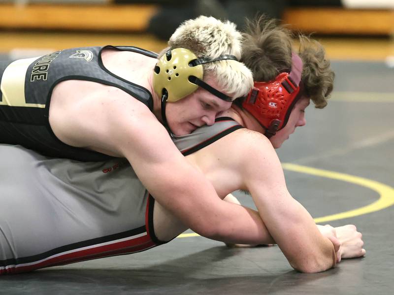 Sycamore’s Adam Carrick tries to turn Ottawa’s Andrew Ristau during their 165 pound match Thursday, Dec. 14, 2023, at Sycamore High School.