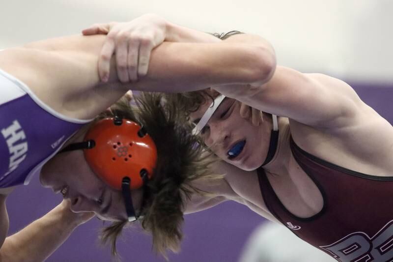 Hampshire’s Aric Abbott,left, battles Prairie Ridge’s Matt Moritz at 157 pounds in varsity wrestling on Thursday, Dec. 5, 2024 at Hampshire High School in Hampshire.
