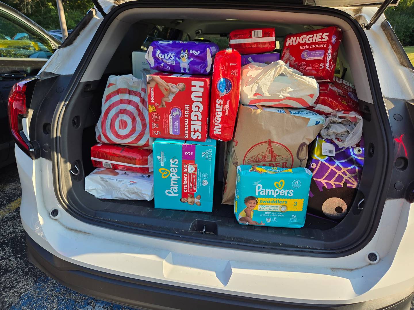 Batavia Woman's Club members regularly collect essential supplies such as diapers and personal care items at their general meetings for the Mutual Ground residents.